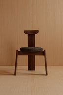 Front-facing view of the chair, highlighting its broad seat and low profile.
